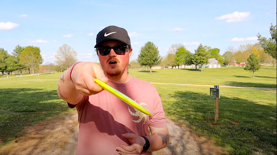 A demonstration of a hyzer disc golf throwing angle