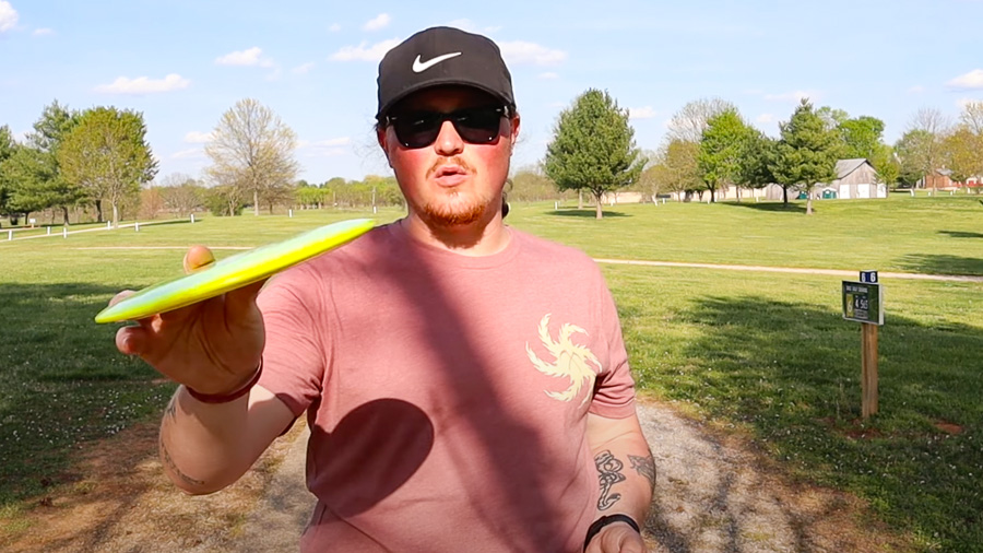 A disc golf player showing an anhyzer angle